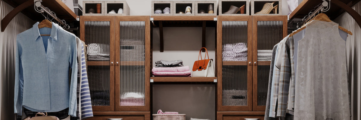 Closeup image featuring John Lous. Home close organizer with doors in a custom designed walk in closet